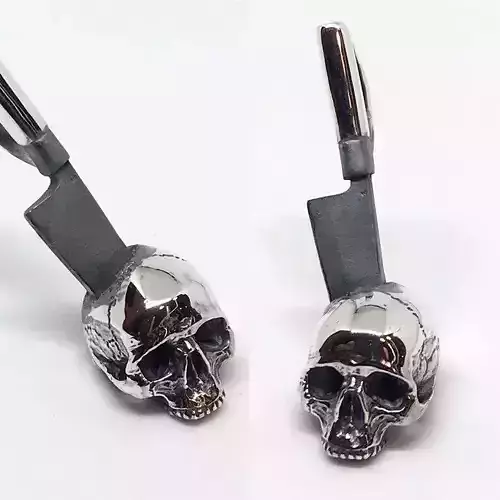 Skull With Knife Pendant