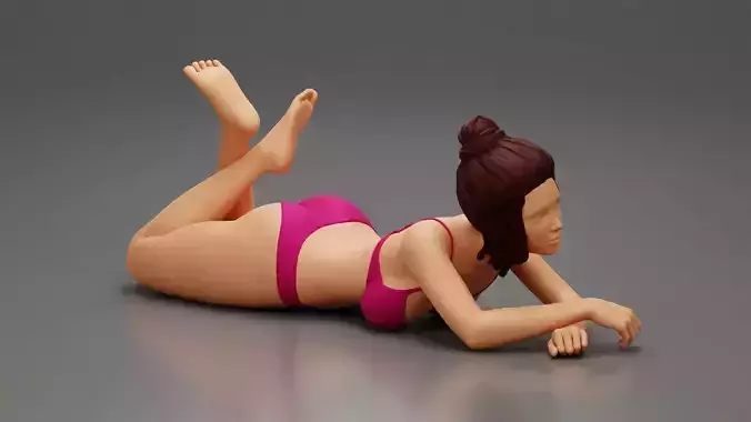 Sexy Young Girl In Bikini Lying On The Sand At The Beach