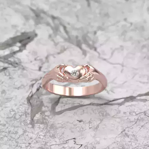 A diamond ring Hands hold the heart