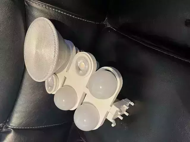 Light bulb holder for pegboard