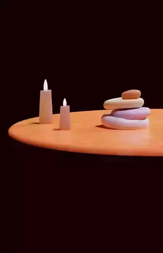 Candle and pebbles scene