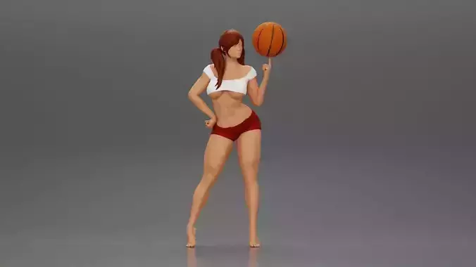 Sexy Young Sporty Girl Playing With the Ball on the Basketball