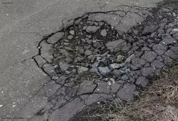 Three sections of asphalt with mortar pits