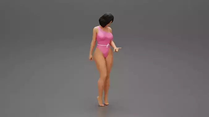 Beautiful girl in onepiece bikini standing on the beach