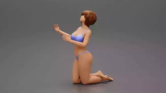 Sexy girl in bikini with short hair sitting on her knees