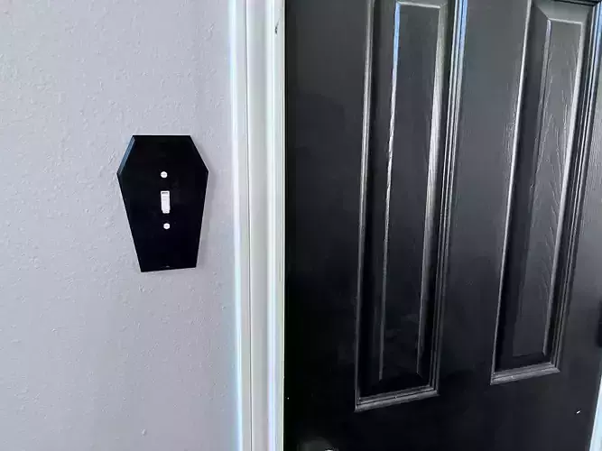 Coffin shaped light switch cover