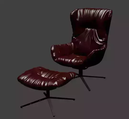 dark red leather armchair and footrest