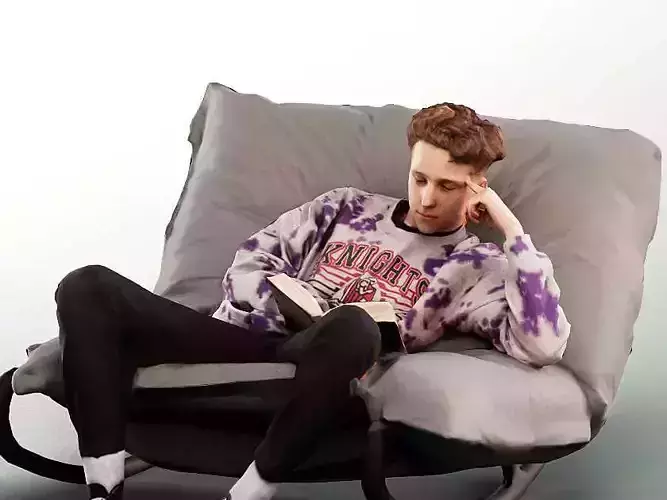 Max 13120 - Young Man Reading On Bean Bag