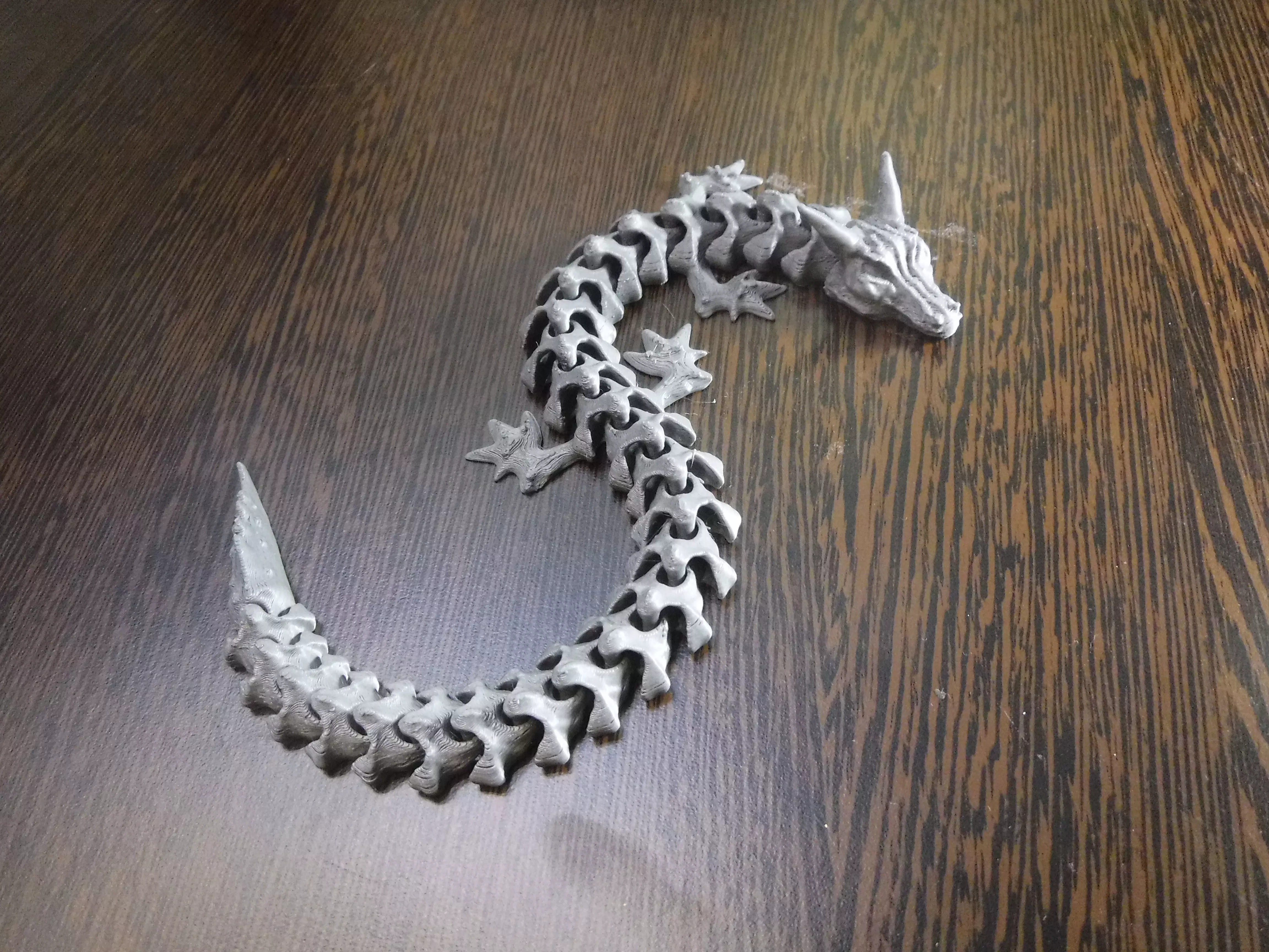Articulated flexi dragon fidget toy 3D print model_0