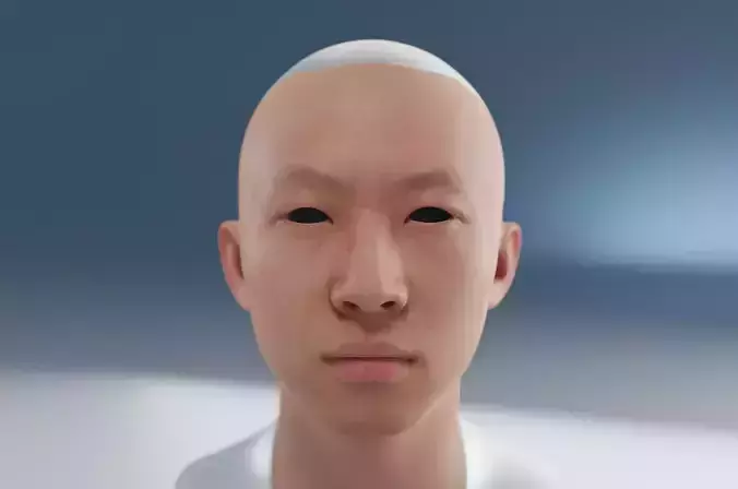 A man with yellow skin and normal sized eyes