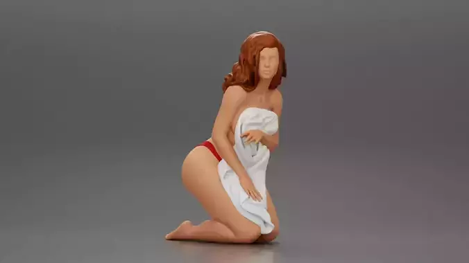 Sexy girl in bikini sitting and covering her body by towel