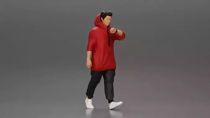 Man in a long hoodie  walking and looking at his watch