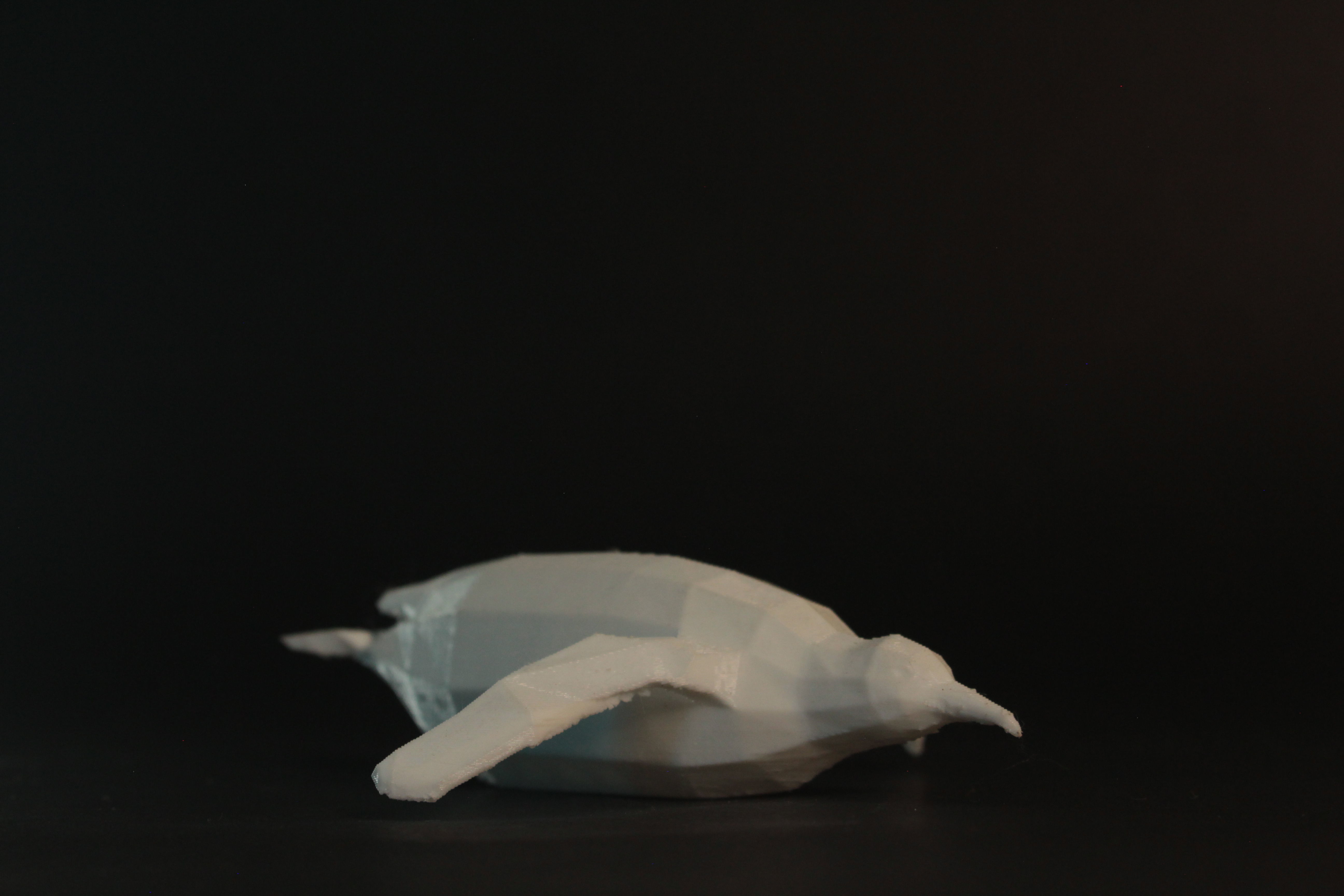 Low Poly Penguin lying down 3D print model_1