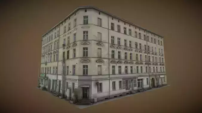 Facade of a tenement house with falling plaster