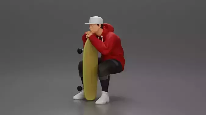 man in hoodie and cap sitting putting his hand on the skateboard