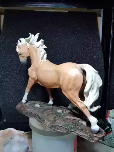 Running horse sculpture