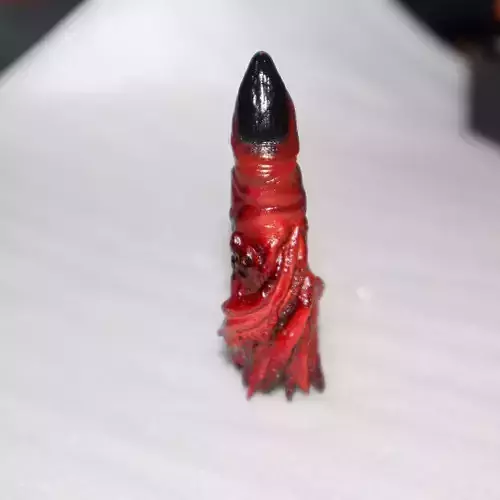 Look alike of Sukunas finger real size and locket and keychain