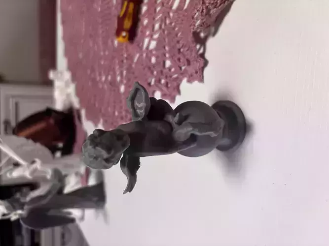 Baby angel with wings sculpture