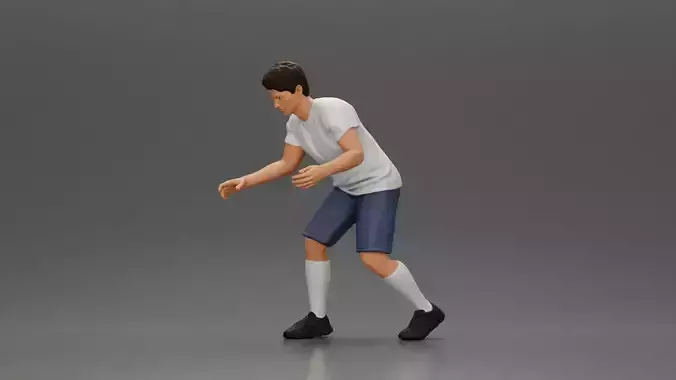 Man in shorts playing table football