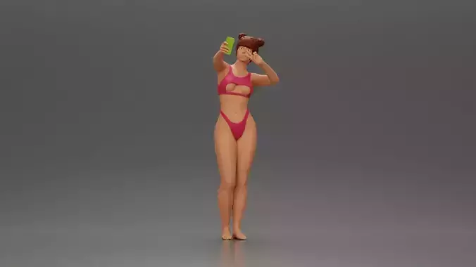 attractive woman in bikini taking selfie with phone on the beach