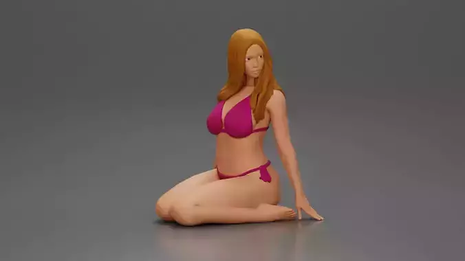 Beautiful Woman in Bikini Sitting on the Beach