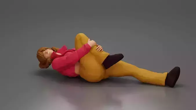 woman in mini jacket lying on the floor touching injured knee