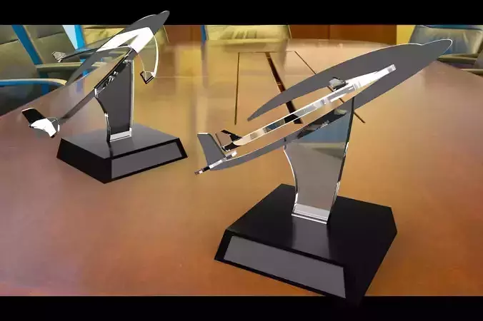 trophie two airplane trophies on table