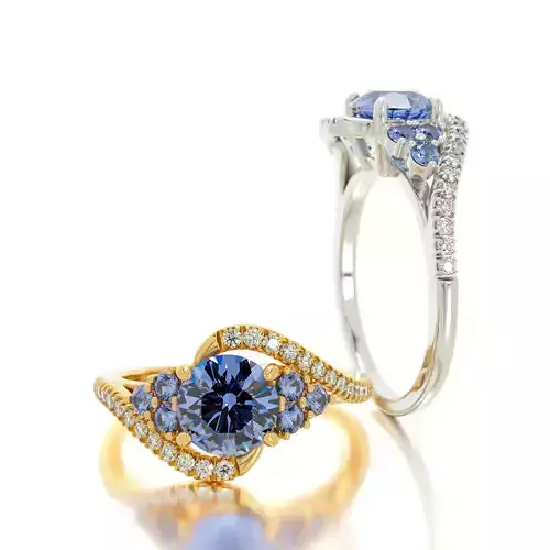 Gold engagement ring with 6 point 5 round sapphire and diamonds 