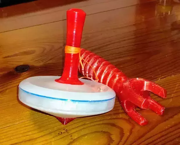 Spinning top with laser for 3-d printing