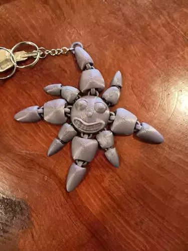smiling sun keychain - flexi fidget toy