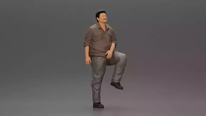 Asian man looking upward in shirt pants with leg placed on step