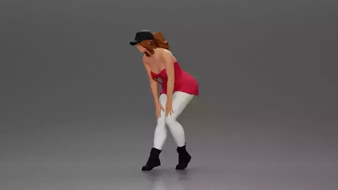 woman placing her hand on her legs wearing a cap and a bra top