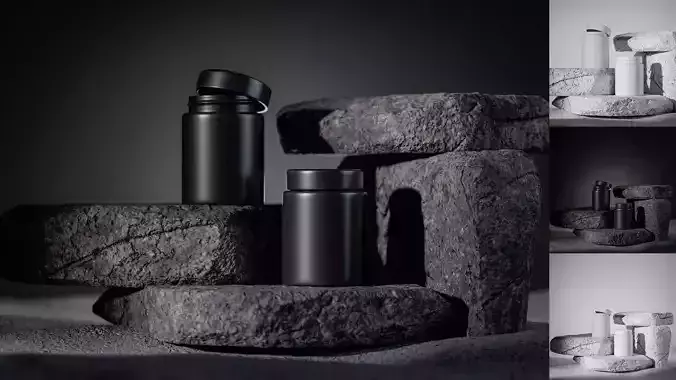 Two black containers on stone surface