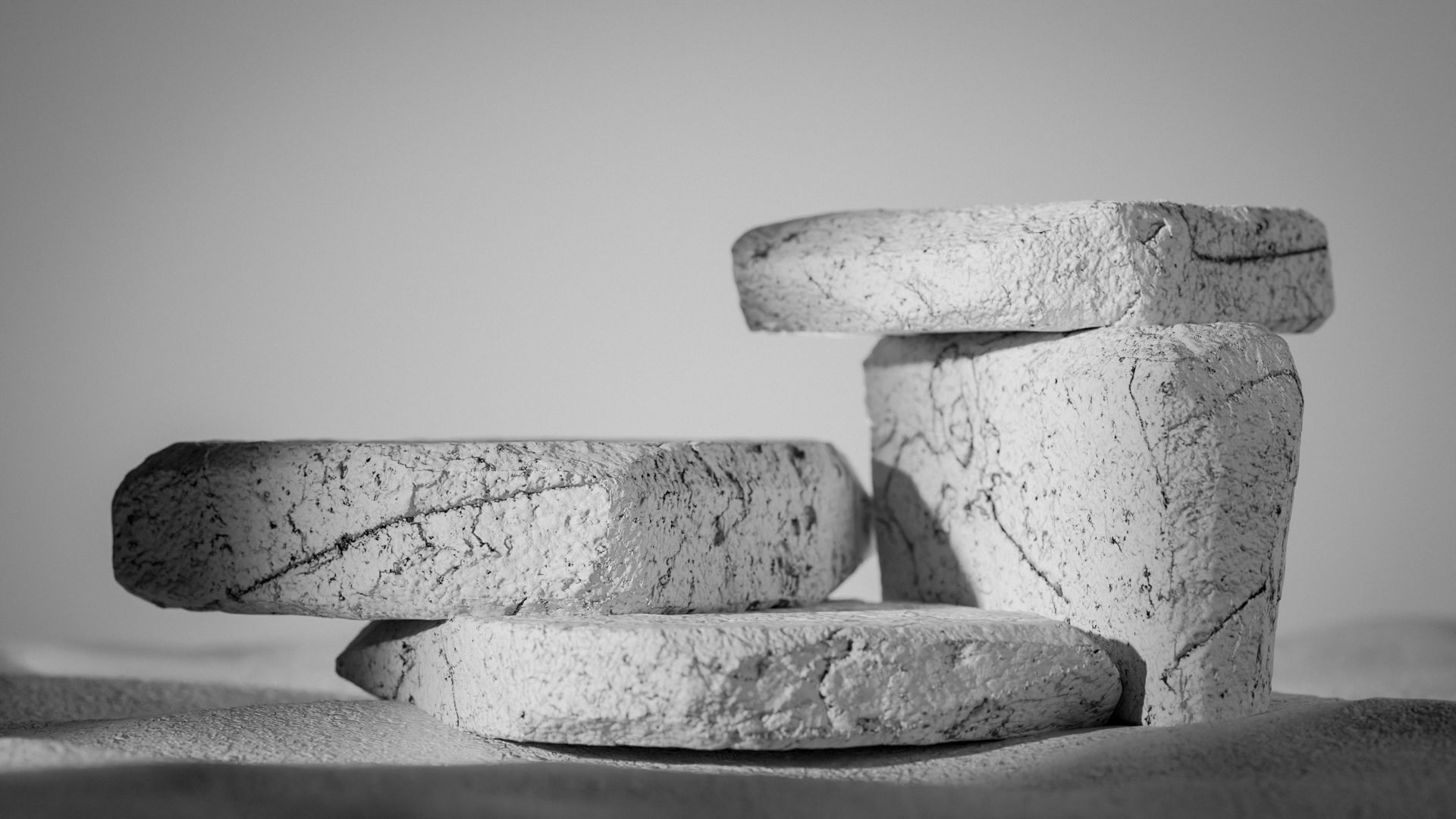 Two black containers on stone surface 3D model_4