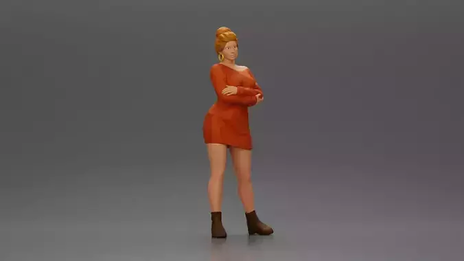 Woman in Dress and Boots Stands Stylishly With Arms Crossed