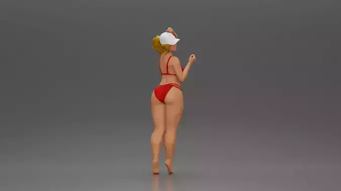 Stylish woman confidently posing in red bikini and white cap