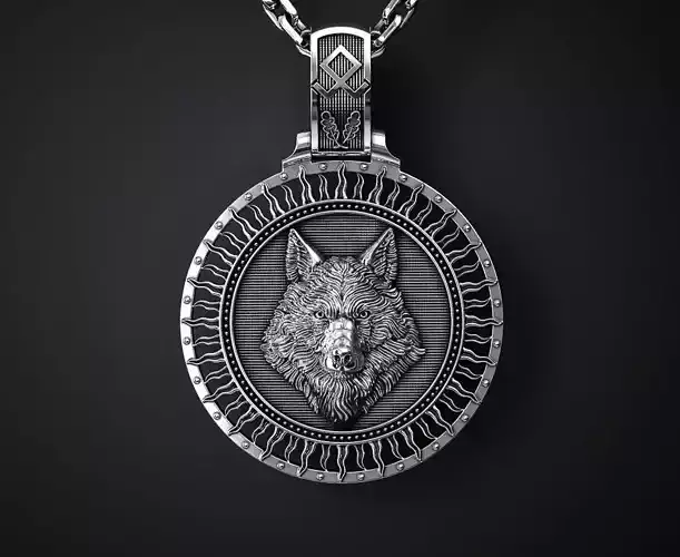 A PENDANT WITH A WOLF S HEAD AND A TREE OF LIFE