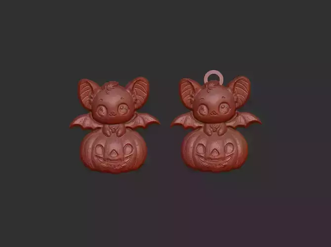 hallowen bat sitting in big pumpkin decor 