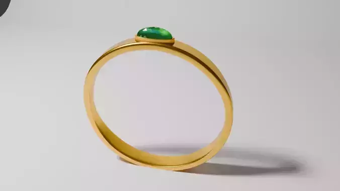Golden ring  with an emerald stone 
