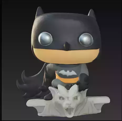 Batman sobre una estatua funko pop