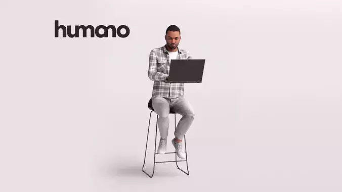 Humano Man sitting on a stool working on laptop -2502-063-2863