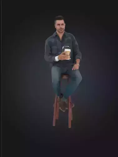 A man sitting with a coffee 