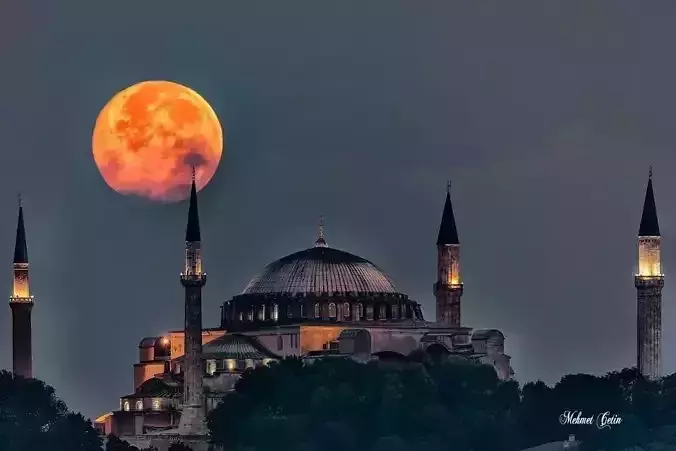 Ruins full moon over mosque in istanbul