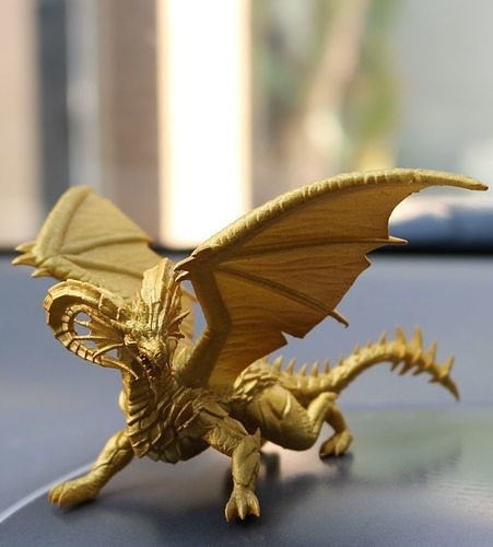 Dragon gold toy on dashboard of car 3D print model 4