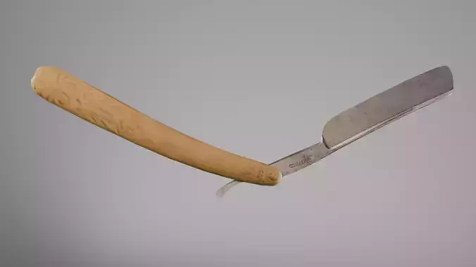 Sheffield straight razor with decorated ivory-colored handle