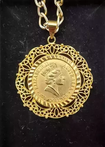 Golden coin pendant 