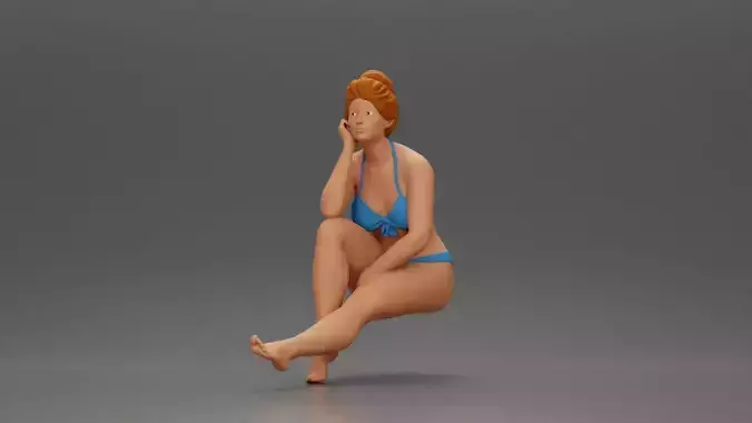 Woman sitting in Blue Bikini Ponders with Relaxed Posture