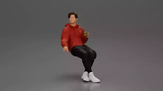 Casually sitting holding a cup enjoying a peaceful moment