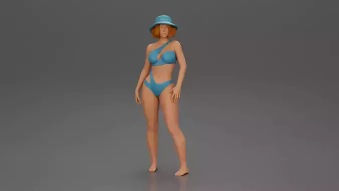 Stylish woman modeling modern asymmetric bikini and hat