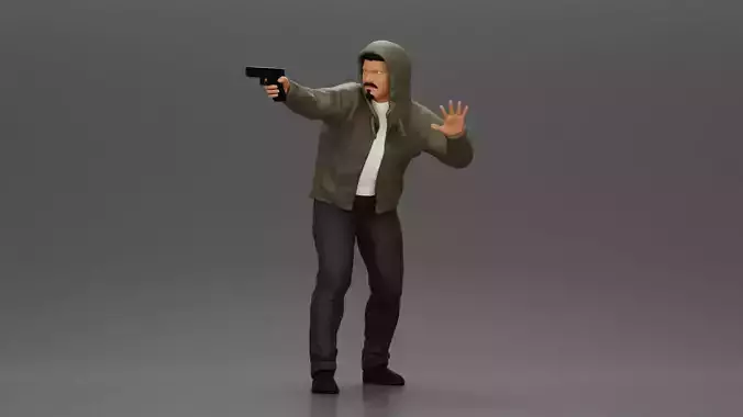 Man in hoodie pointing gun while raising hand in defensive